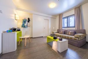 a living room with a couch and a table at Hotel Cristina in Pas de la Casa