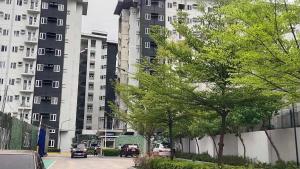 a city street with tall buildings in the background at 2BR Mountain View Condo SMDC Charm Metro Manila in Manila