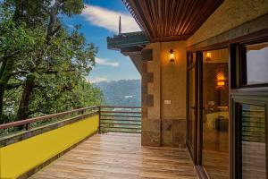 a balcony of a house with a view at Lake View 2BHK close to mall road l Lake Daze in Nainital