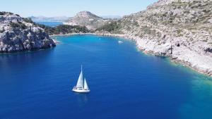 a sail boat in a large body of water at Sailing Edisa Rhodes Adventures in Rhodes Town