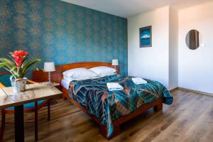 Postel nebo postele na pokoji v ubytování Hotel Zielonki
