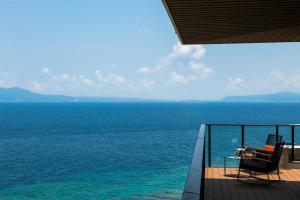 a balcony with a view of the ocean at Hyatt Regency Seragaki Island Okinawa in Onna