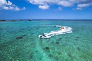two boats in the water in the ocean at Hyatt Regency Seragaki Island Okinawa in Onna