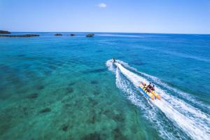 a group of people on a raft in the water at Hyatt Regency Seragaki Island Okinawa in Onna