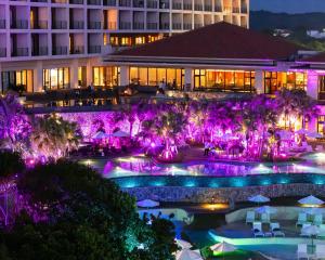 a view of the pool at the resort at night at Hyatt Regency Seragaki Island Okinawa in Onna