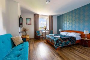 Postel nebo postele na pokoji v ubytování Hotel Zielonki + 36 fotografií