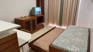 Телевизор и/или развлекательный центр в Náutico Flat Service