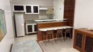 Кухня или мини-кухня в Náutico Flat Service
 +16 фотографий