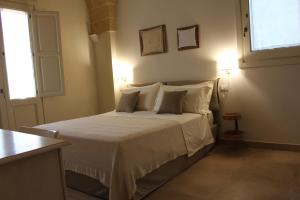 Giường trong phòng chung tại Agriturismo Lovetere +52 ảnh