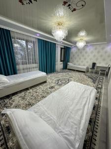 Postel nebo postele na pokoji v ubytování Guest House NAZIRA
