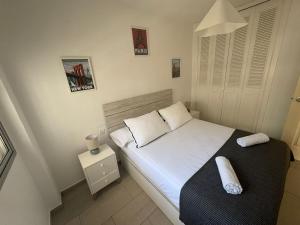 Postel nebo postele na pokoji v ubytování Apt Acogedor con Piscina en Fuengirola + 18 fotografií