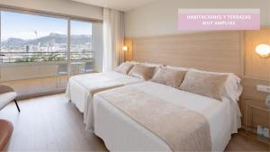 Postel nebo postele na pokoji v ubytování Hotel RH Ifach