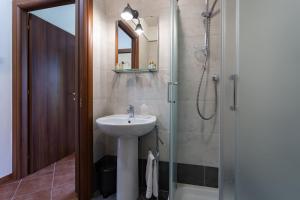 a bathroom with a sink and a shower at CS Holiday in Castelnuovo Berardenga +26 photos