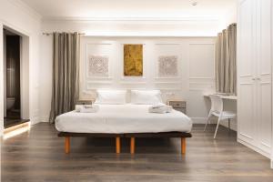 Postel nebo postele na pokoji v ubytování Enjoybcn Coliseum Apartments