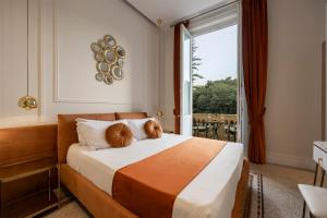 a hotel room with a bed with a large window at Villa Libertà in Palermo