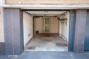 an empty room with a door in a building at Une escale à Malo in Dunkerque
