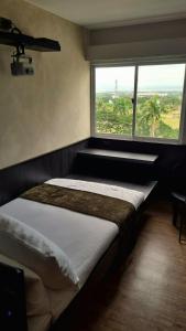 Katil atau katil-katil dalam bilik di Chill spot with Projector and PS4