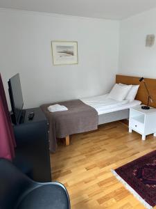 Letto o letti in una camera di Värdshuset Hwitan
