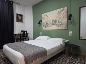 Postel nebo postele na pokoji v ubytování Hotel Le Centre