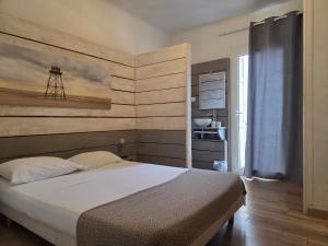 Postel nebo postele na pokoji v ubytování Hotel Le Centre