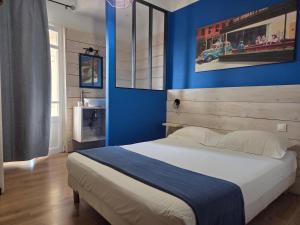 Postel nebo postele na pokoji v ubytování Hotel Le Centre