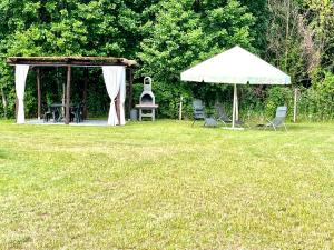 Zahrada ubytování Tatra Glamp Mazury - sieć noclegowa Tatra Glamp