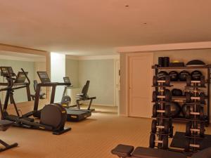 a gym with several exercise equipment in a room at Pensione America - Adults only in Forte dei Marmi