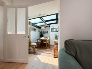 an open door to a dining room with a table at Charmante maison proche village Vendée Globe - 6 personnes in La Chaume +11 photos