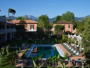 an aerial view of a house with a swimming pool at Pensione America - Adults only in Forte dei Marmi