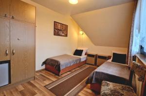 Posteľ alebo postele v izbe v ubytovaní Pokoje Apartamenty Pod Limbą