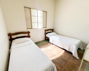 Ένα ή περισσότερα κρεβάτια σε δωμάτιο στο Elite Economy Hotel - Banheiro Compartilhado