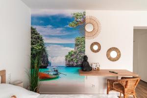 a room with a desk and a view of the ocean at Apartamenty Wilkasy Jezioro Niegocin in Wilkasy