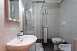 a bathroom with a sink and a shower and a toilet at CS Holiday in Castelnuovo Berardenga