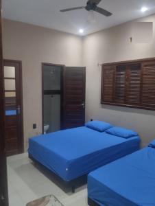 Ένα ή περισσότερα κρεβάτια σε δωμάτιο στο Linda Casa nos Pequenos Lençóis