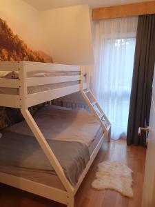 Posteľ alebo postele v izbe v ubytovaní DivciCasa apartments Divčibare