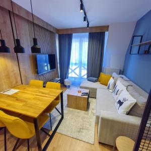 Televízia a/alebo spoločenská miestnosť v ubytovaní DivciCasa apartments Divčibare