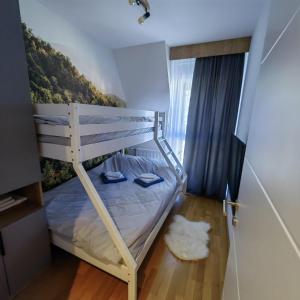 Posteľ alebo postele v izbe v ubytovaní DivciCasa apartments Divčibare