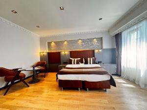 A bed or beds in a room at Blue Istanbul Hotel Taksim