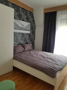 Posteľ alebo postele v izbe v ubytovaní DivciCasa apartments Divčibare