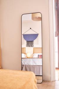 a mirror in a room with a bed at The Nest - by Wehomes in Santander