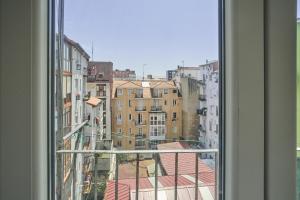 a view of a city from a window at The Nest - by Wehomes in Santander