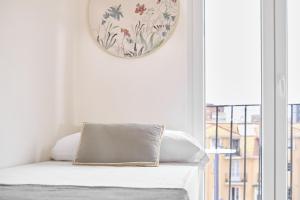 a room with a bed with a mirror on the wall at The Nest - by Wehomes in Santander