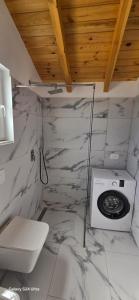 a bathroom with a toilet and a sink at Kompleksi Turistik ARMANDO in Tale +31 photos