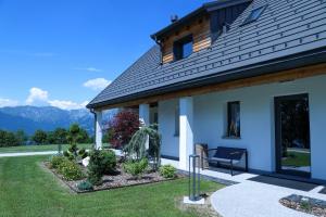 a house with a view of the mountains at Cinque Sensi Wellness Apartments in Braz