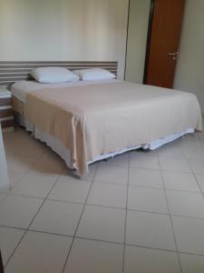 Postel nebo postele na pokoji v ubytování Akropolis Home - Cabo Branco