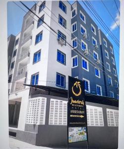 a building with a sign in front of it at Deanway homes in Mombasa