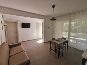 a living room with a couch and a table at La Bianca Dimora in Sulmona