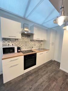 Kuchyň nebo kuchyňský kout v ubytování Vilnius - Confort familial