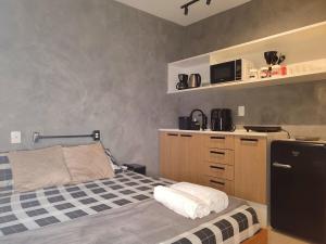 Studio com piscina no Casa Mauá客房内的一张或多张床位