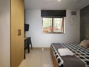 Studio com piscina no Casa Mauá客房内的一张或多张床位